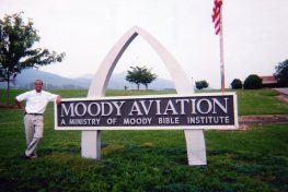 Emma with Moody Aviation sign